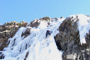 Reaching the top ice climbing