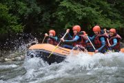 Family river rafting in the Pyrenees