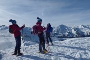 Reaching the summit on a Pyrenees snowshoeing holiday