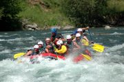 Mates having fun rafting on the river