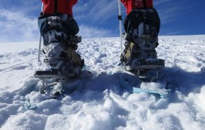 Use the heel riser bars on the snowshoes