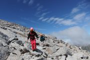 Learning how to handle uneven terrain on alpinism course