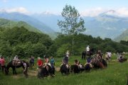 Horse riders taking a break on horse trekking holiday in Pyrenees