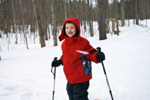 Boy on family snowshoeing adventure