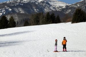 Children on a family snowshoe adventure