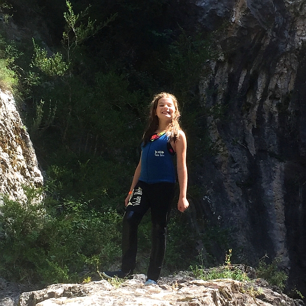 Young girl proud of herself canyoning