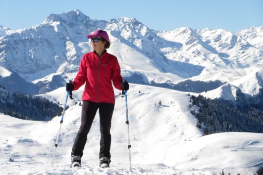 lady snowshoeing in the Pyrenees mountains